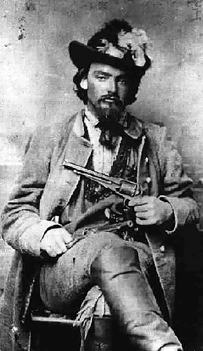 Pictured is either John McCorkle or George Maddux with an 1858 Remington in each hand.